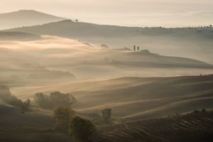 Glowing morning fog at Val d'Orcia with a Telephoto Lens